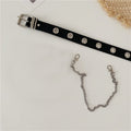 Women’s black grommet belt with silver-tone buckle and separate decorative chain shown beside it