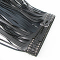 Women’s black statement waist belt with long flowing tassel fringe