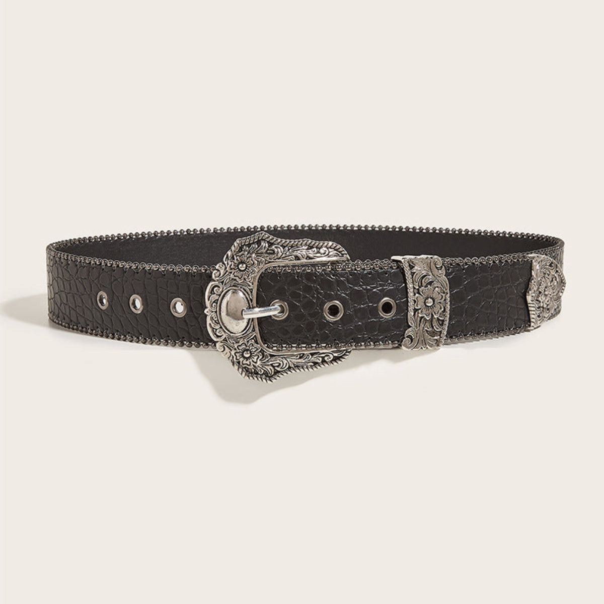 Full front view of women’s black Western belt with ornate silver-tone floral buckle and decorative hardware