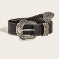 Women’s black Western belt with ornate silver-tone floral buckle and textured finish shown rolled