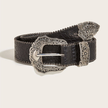 Women’s black Western belt with ornate silver-tone floral buckle and textured finish shown rolled