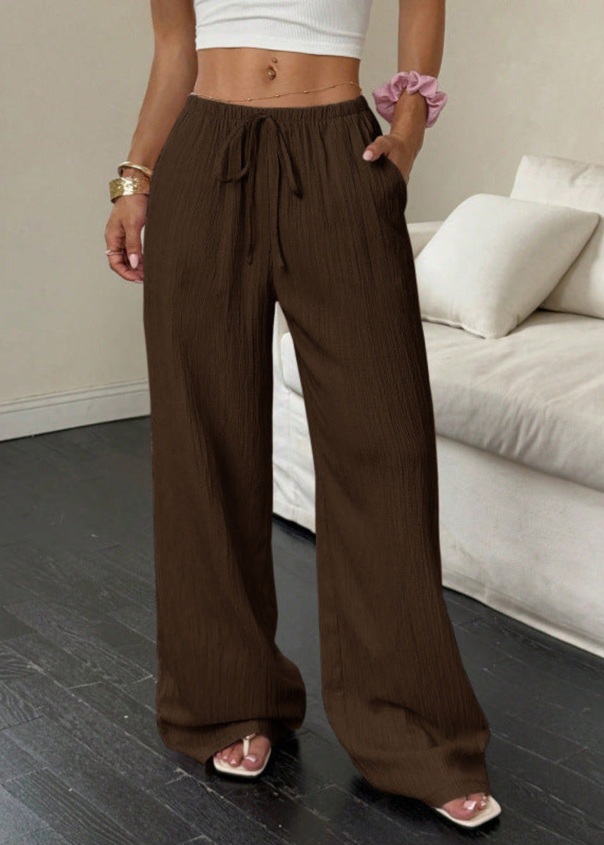 Women's dark brown high-waist drawstring wide-leg pants with textured fabric, side pockets and relaxed fit