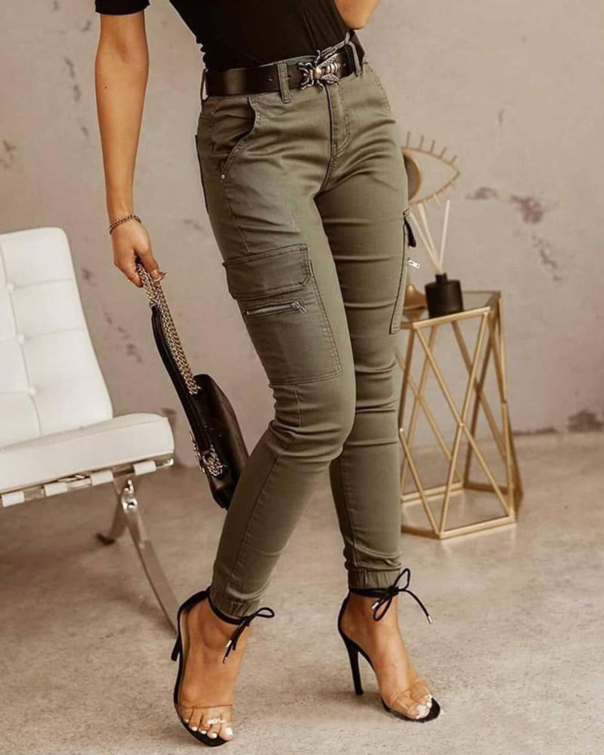 Women's olive green high-waist slim cargo pants with side utility pockets and tapered ankle fit