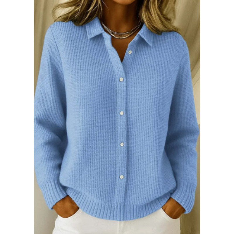 Woman wearing a light blue button-down knit sweater with collared neckline, long sleeves and ribbed hem