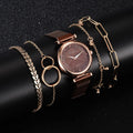 Women's rose gold watch with brown mesh band and coordinating gold-tone bracelet jewelry set