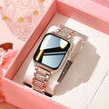 Women's rose gold Bluetooth smartwatch with crystal-accented metal band and rectangular touchscreen display