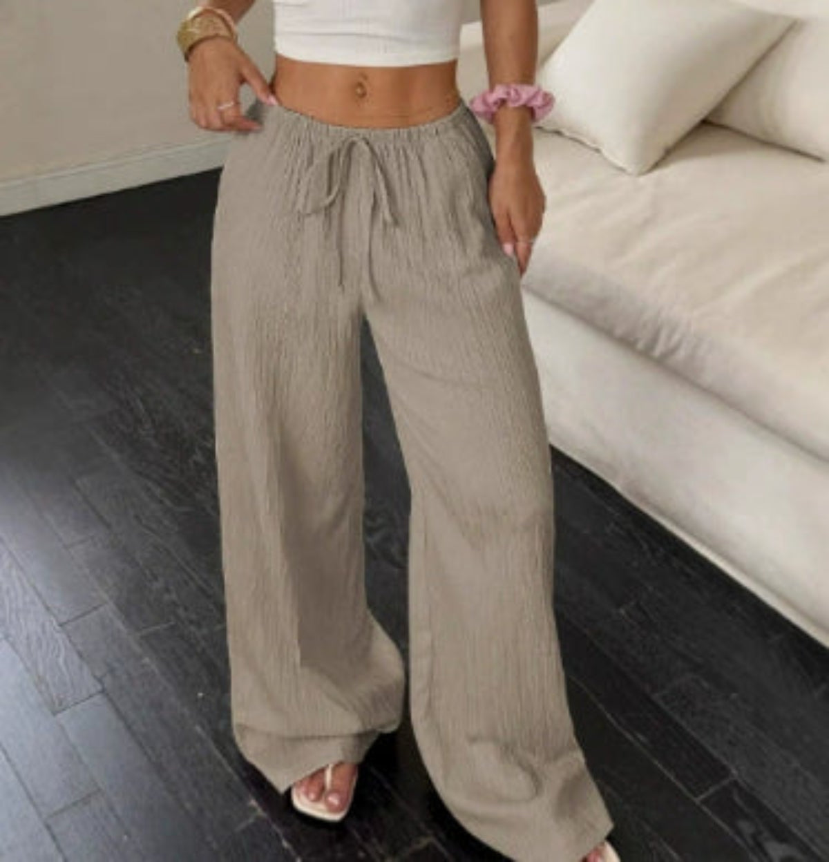 Women's taupe high-waist drawstring wide-leg pants with textured fabric, side pockets and relaxed fit