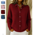 Woman wearing a wine red button-down knit sweater with collared neckline and long sleeves