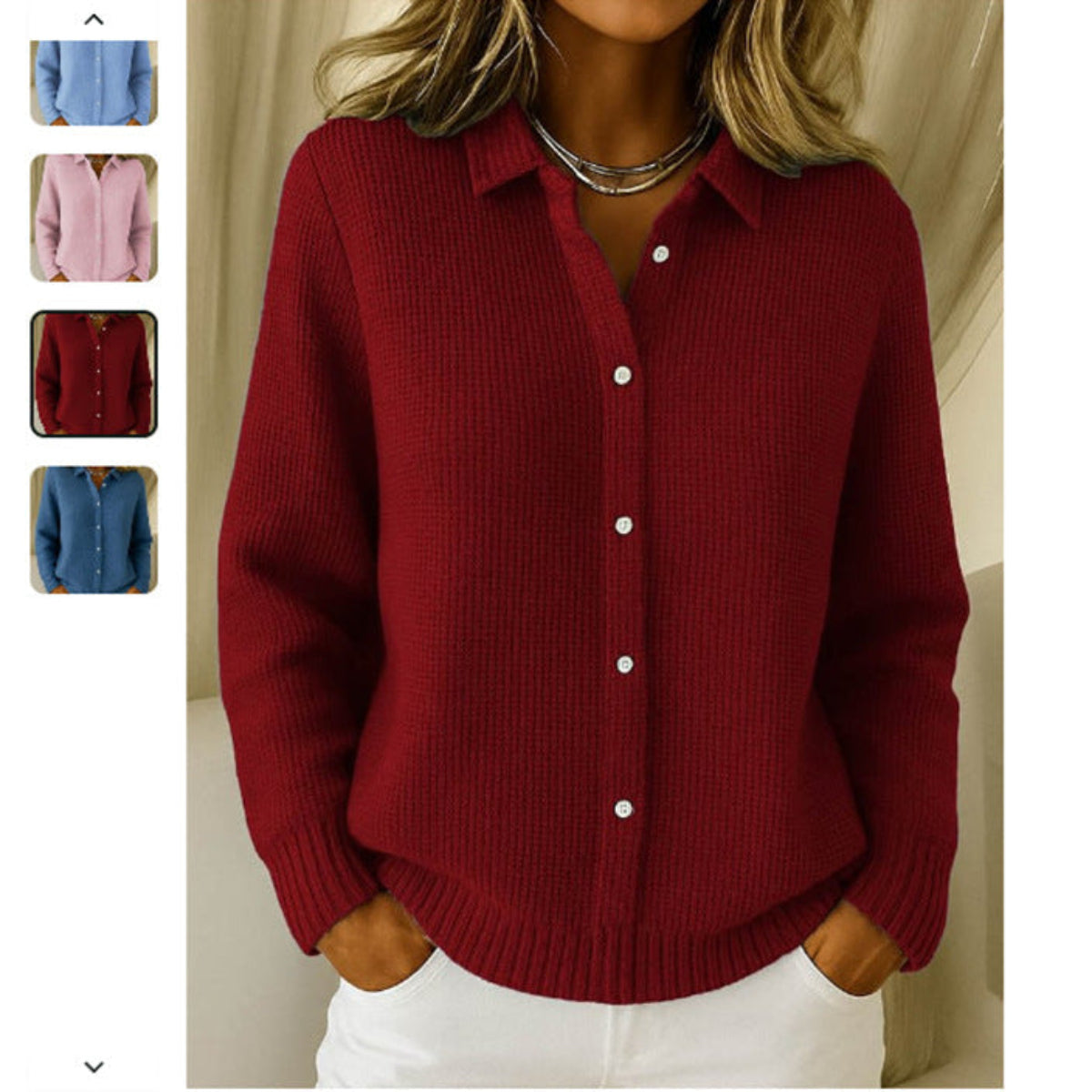 Woman wearing a wine red button-down knit sweater with collared neckline and long sleeves