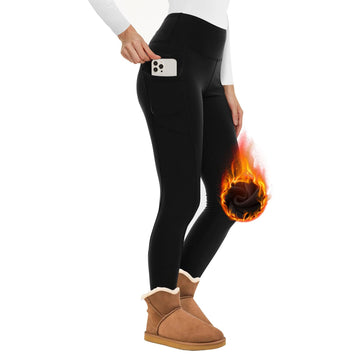 Zara women's black high-waisted thermal leggings displayed from an angled side view on a model, featuring a fitted waistband, smooth stretch silhouette through the hips and thighs, tapered full-length legs, and black fabric designed for fashionable cold-weather layering. A flame graphic near the lower leg illustrates the supplier's advertised fleece-lined thermal design.