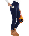 Zara women's navy blue high-waisted thermal leggings displayed on a model, featuring a fitted silhouette that follows the natural shape of the hips and legs, smooth opaque-looking fabric, ankle-length construction, and a high-rise waist for a coordinated cold-weather casual look.